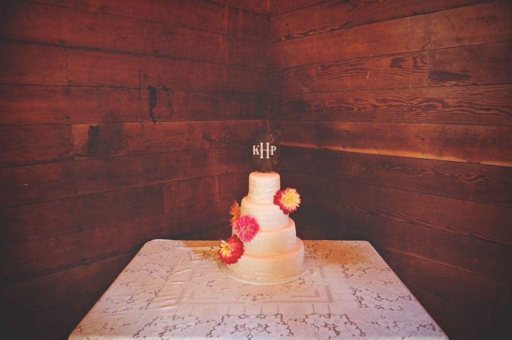 white wedding cake with orange flowers