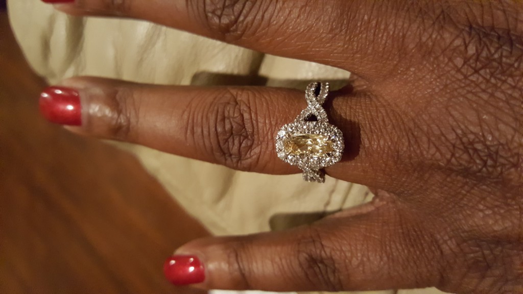 Yellow diamond engagement ring closeup