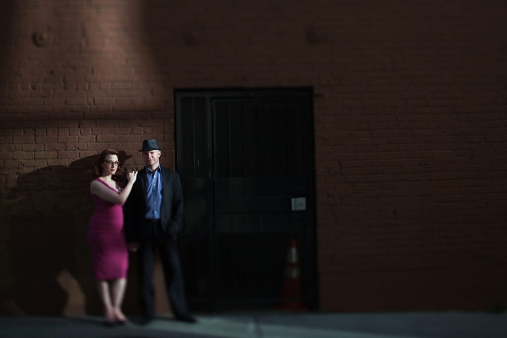 woman and man posing for engagement photo shoot in belltown seattle