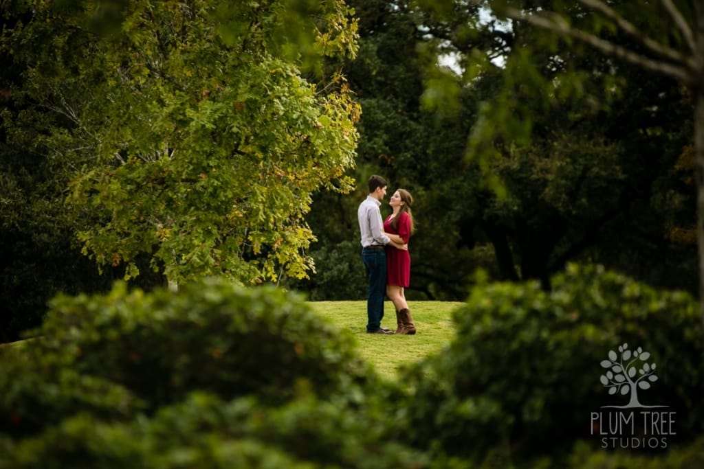 couple embracing at mcgovern centennial garden in houston
