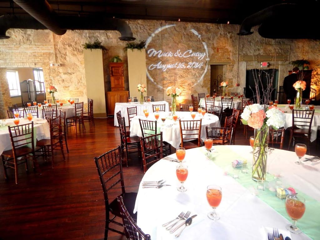 dramatically lit interior of the reception hall in San Antonio’s The Grande Promenade wedding venue